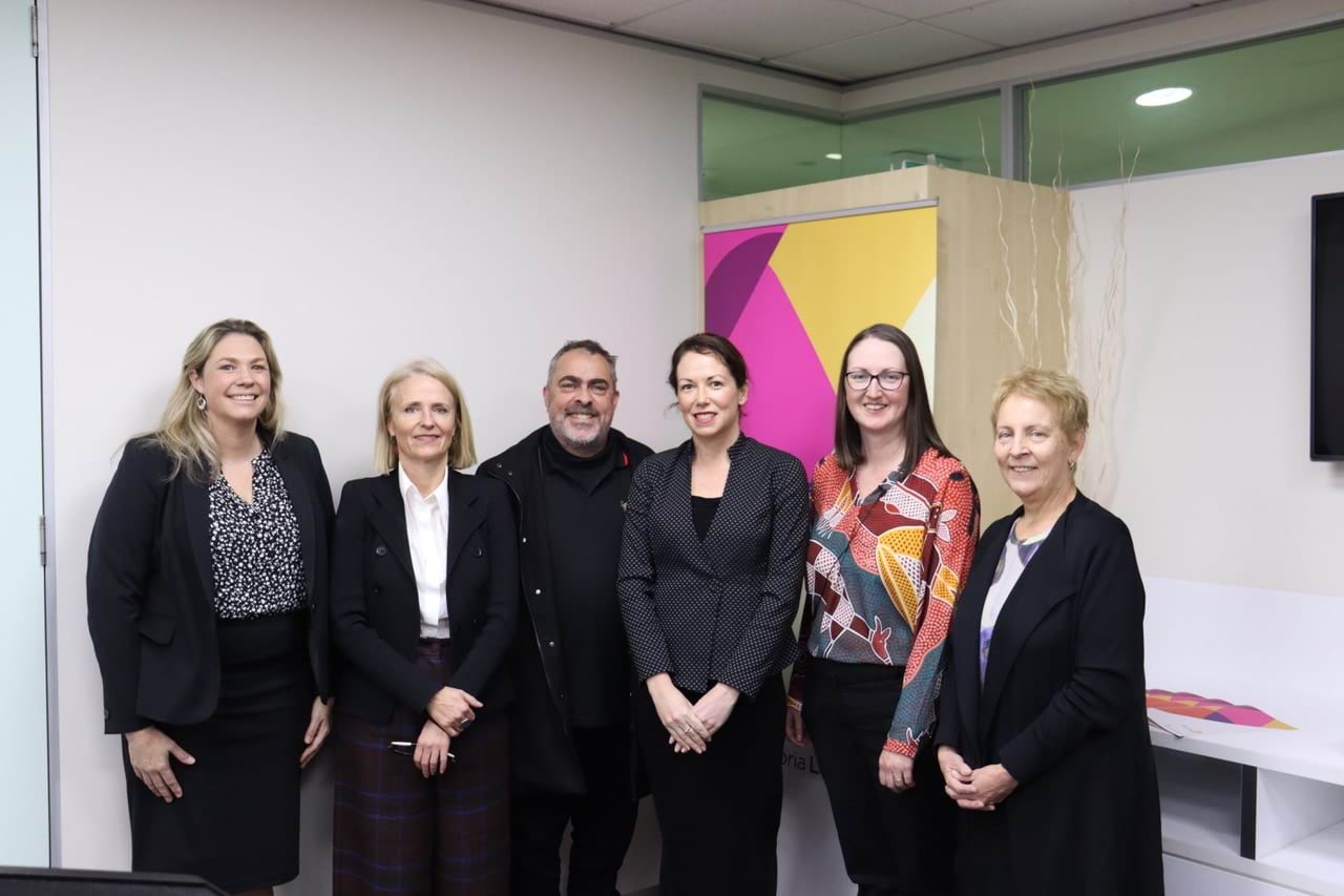 Six people standing L–R: CEO of the Federation of Community Legal Centres Louisa Gibbs, acting Victoria Legal Aid Board Chairperson Robbie Campo, Local Aboriginal Justice Worker at Kirrip Aboriginal Corporation Keenan Madden, Victorian Attorney-General the Hon Jaclyn Symes, Managing Lawyer South West - Sunshine Liz Hughes and our CEO Louise Glanville.