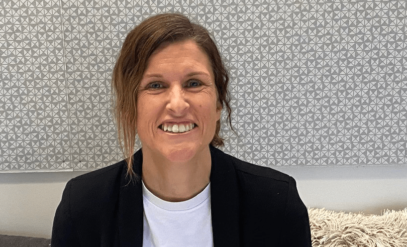 Photo of Kate Jones smiling.