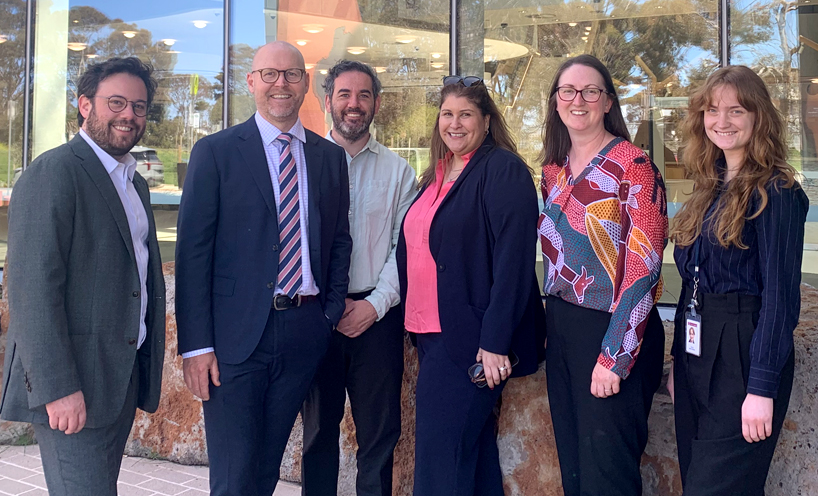 Victoria Legal Aid staff standing outside the Wyndham Law courts.